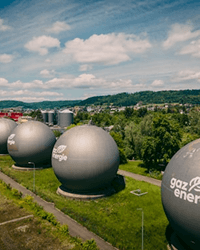 man looking at wind a turbine